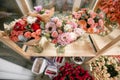 Different varieties. Fresh spring flowers in refrigerator for flowers in flower shop. Bouquets on shelf, florist Royalty Free Stock Photo