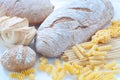 Different varieties of Italian pasta and homemade bread Royalty Free Stock Photo