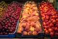 Different varieties of peaches on sale in a local market.