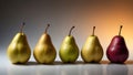 Different varieties of pears displayed in a row with warm lighting showcasing their unique colors and shapes in a Royalty Free Stock Photo