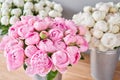 Different varieties of peonies in a metal vases. Beautiful peony flower for catalog or online store. Floral shop concept