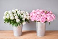 Different varieties of peonies in a metal vases. Beautiful peony flower for catalog or online store. Floral shop concept