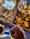 Different varieties of potatoes on display in wicker baskets Royalty Free Stock Photo