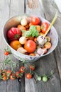 Different varieties of tomatoes with garlic, basil. Royalty Free Stock Photo