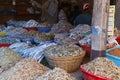 Different variety of dry fishes stored in a basket for sell in a market stall