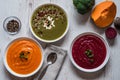 Different vegan food. Colorful vegetables cream soups and ingredients for soup. Healthy eating, dieting, vegetarian Royalty Free Stock Photo