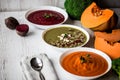 Different vegan food. Colorful vegetables cream soups and ingredients for soup. Healthy eating, dieting, vegetarian Royalty Free Stock Photo