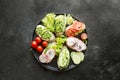 Different vegan sandwiches with vegetables, radish, tomato, rye bread on black. Appetizer for party Royalty Free Stock Photo