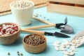 Different vegetable seeds and gardening tools on light blue wooden table Royalty Free Stock Photo