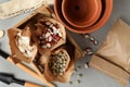 Different vegetable seeds and gardening tools on light grey table, flat lay