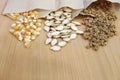 Different vegetable seeds on wooden table, closeup Royalty Free Stock Photo