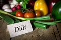 Different vegetables on a old wooden table, card with word diÃÂ¤t