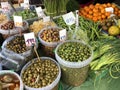 Different vegetables, olives, dried fruits on a local market Royalty Free Stock Photo