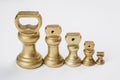 Different vintage brass weights unit standing Royalty Free Stock Photo