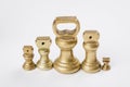 Different vintage brass weights unit standing Royalty Free Stock Photo