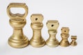 Different vintage brass weights unit standing Royalty Free Stock Photo