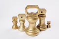 Different vintage brass weights unit standing Royalty Free Stock Photo
