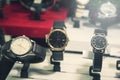 Different watchs in store background. Royalty Free Stock Photo