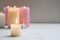 Different wax candles burning