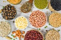 Different whole grains beans on bowl and legumes seeds lentils and nuts colorful snack background top view - Collage various beans Royalty Free Stock Photo