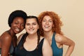 Different Women. Group Of Diversity Models Portrait. Smiling Multiethnic Female In Fitness Clothes Posing On Beige Background.