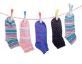 Different women`s socks on the clothes line with clothespins