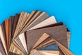 Different wooden samples for furniture isolated on blue Royalty Free Stock Photo