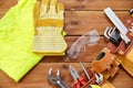 Different work tools in belt on wooden boards