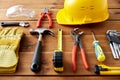 Different work tools on wooden boards