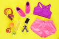 Different workout essentials on yellow floor