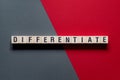 Differentiate - word concept on cubes Royalty Free Stock Photo