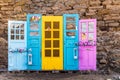 Differently coloured front doors as a background Royalty Free Stock Photo