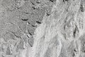 Differently textured gray cement sand wall. Abstract close up surface photo of grains for wallpaper or background.