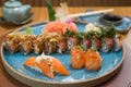 Differents japanese sushi on a elegant blue plate Royalty Free Stock Photo