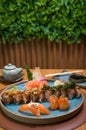 Differents japanese sushi on a elegant blue plate Royalty Free Stock Photo