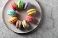 Differnt color macaroons on a plate