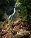 Difficul trail with ladder near the waterfall in canyon of National park Slovak paradise