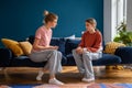 Difficult conversation mother and sad teenager at home. Upset teen girl listens to mom admonitions Royalty Free Stock Photo