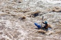 A difficult section on the river is overcome by a man on a kayak Royalty Free Stock Photo