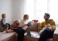 Difficulties of family with three kids during quarantine. Stay at home concept. Online working and household at the same time Royalty Free Stock Photo