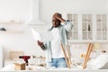 Difficulties and problems in assembling of new furniture. Confused african american man reading instruction