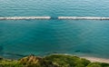 Diffraction waves in the sea seen along the coastline near Pesaro Royalty Free Stock Photo