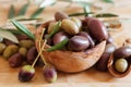 Olives on wooden background, kalamata, kalamon, green olives