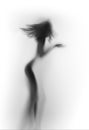Diffuse silhouette of a beautiful slim woman with blowing hair. Royalty Free Stock Photo