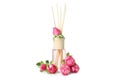 Diffuser bottle with roses isolated on white background Royalty Free Stock Photo