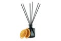 Diffuser bottle with sticks and orange slices isolated on white background Royalty Free Stock Photo