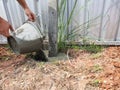 Dig a deep hole in the soil to pour mortar.