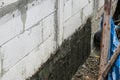 dig soil prepare plaster cement. lightweight cement brick and white lintel plasters to joint for reinforce widow house frame in