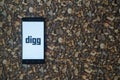 Digg logo on smartphone on background of small stones