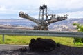 Digger and brown coal open cast mining Royalty Free Stock Photo